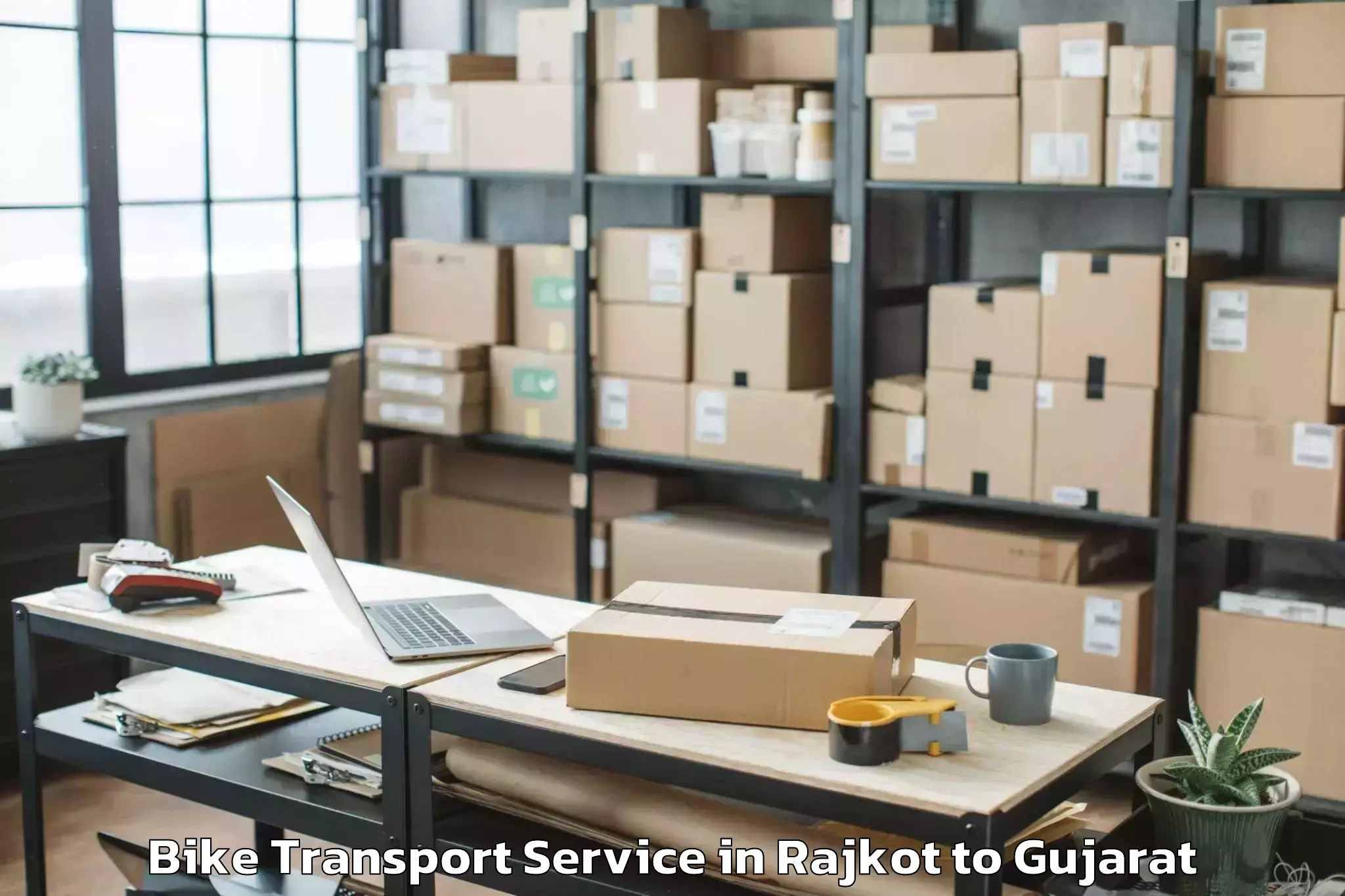 Top Rajkot to Abhilashi University Surat Bike Transport Available